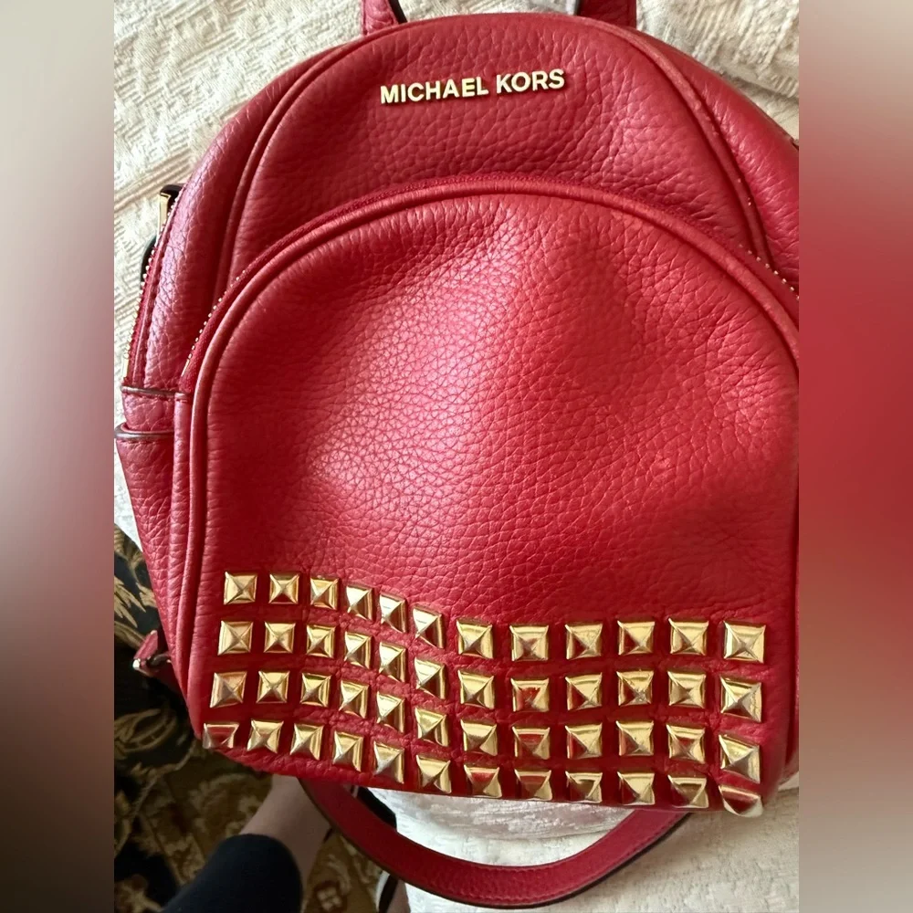 Michael Kors Abbey XS Studded Red Backpack with Gold Studs
Size 7 by 8 by 3 - Picture 10 of 16